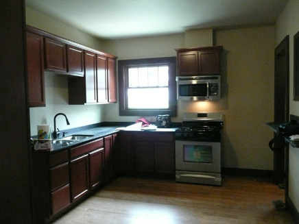 [Photo: kitchen after]